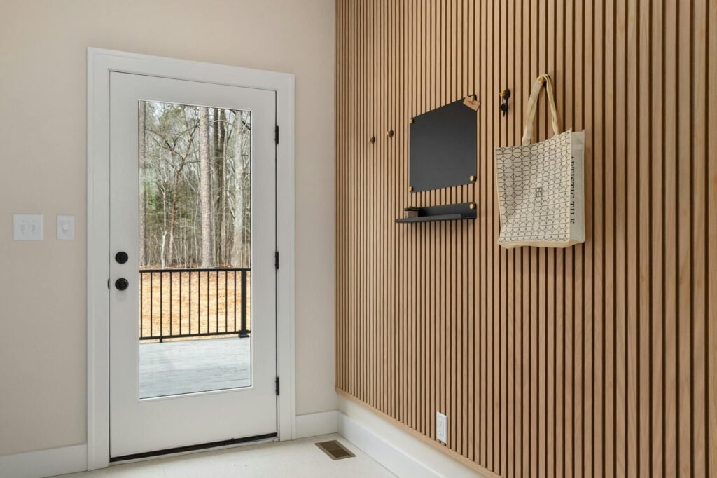 A neatly staged entryway with a bag, keys, and planner prepared for the next day