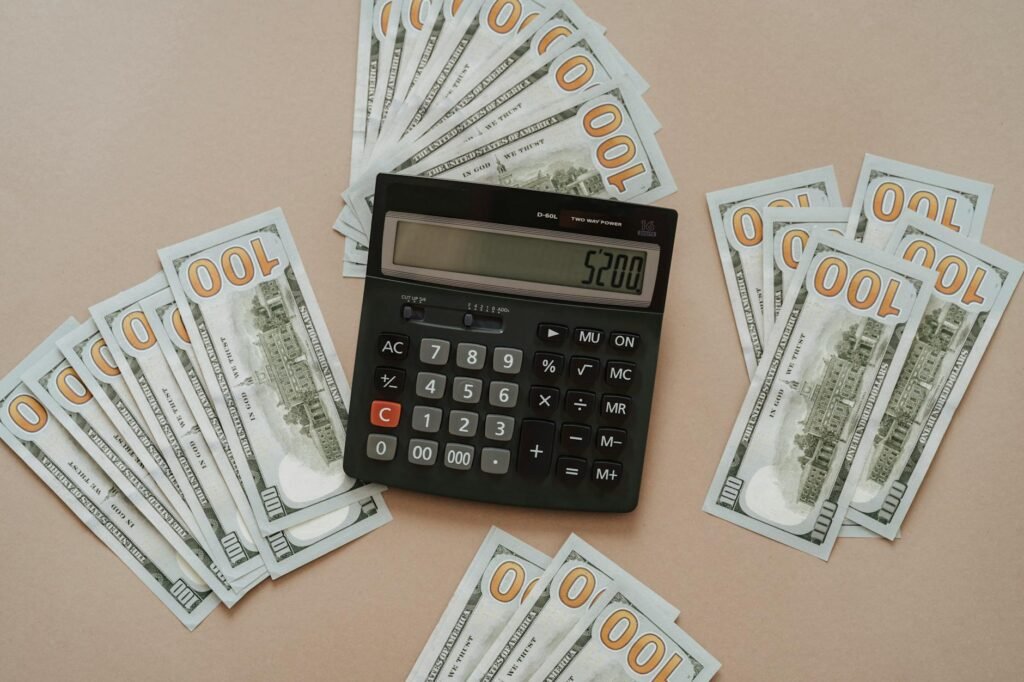 A household calendar, calculator, and utility bill on a kitchen table