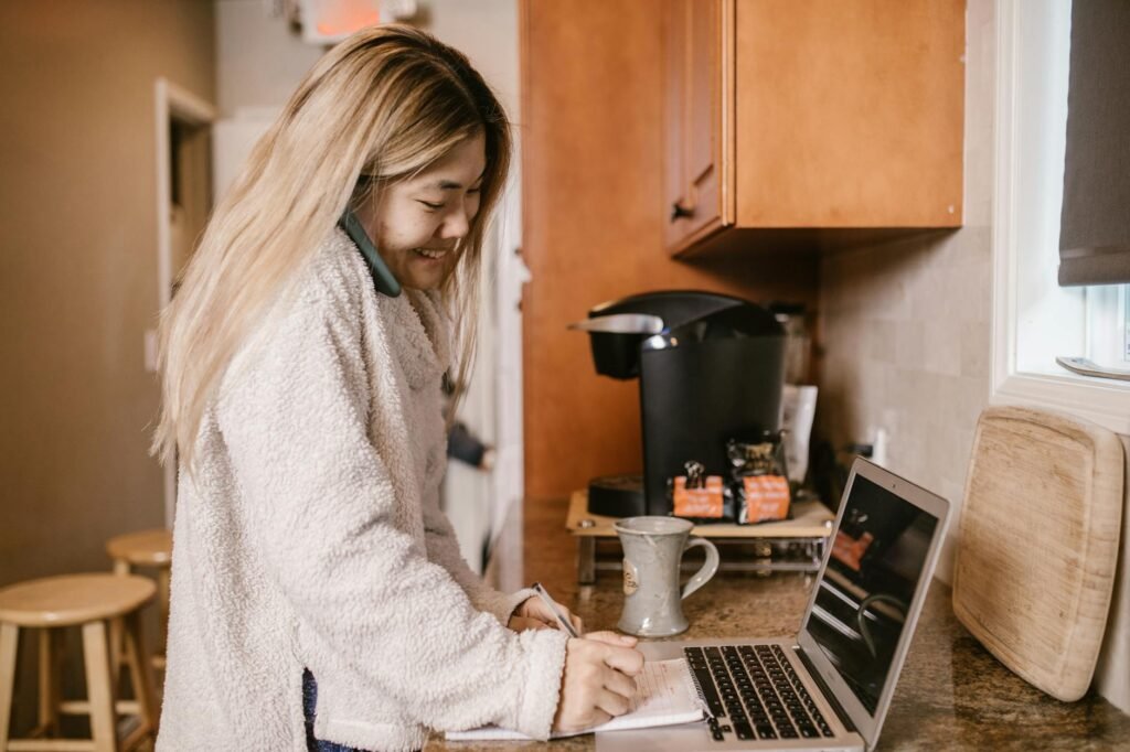 A kitchen counter with coffee supplies, sparkling water, and a notebook for tracking habits.