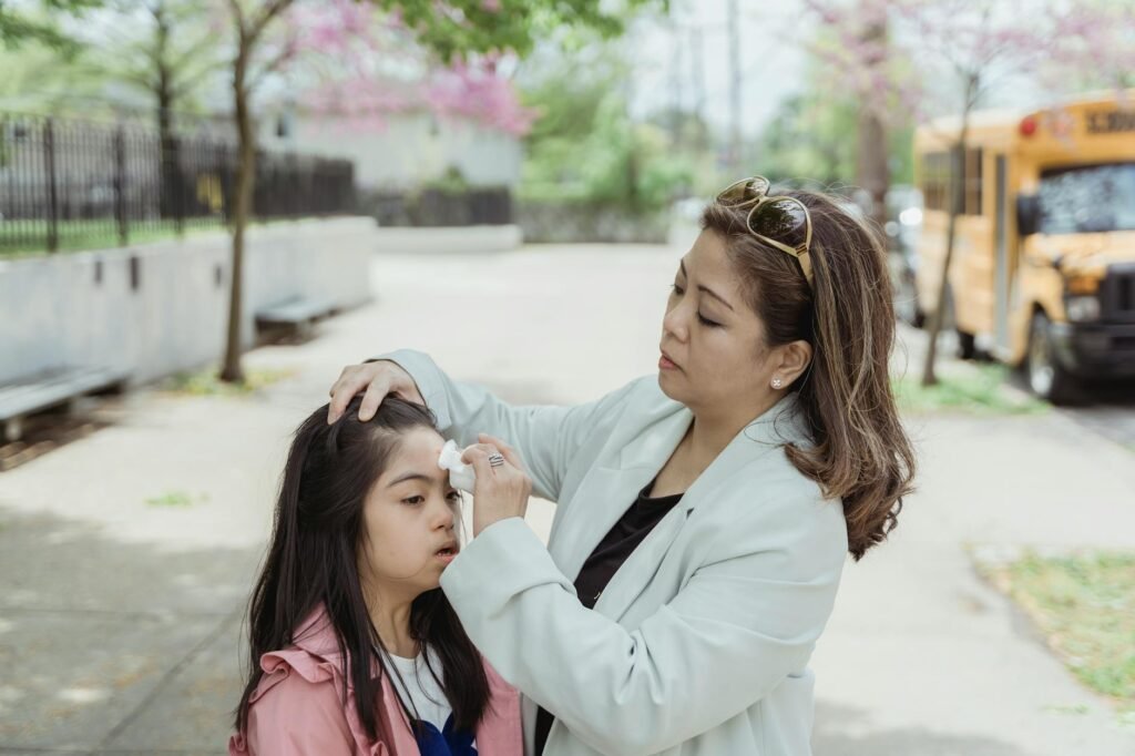 A parent walking outside with a child in the morning on the way to school