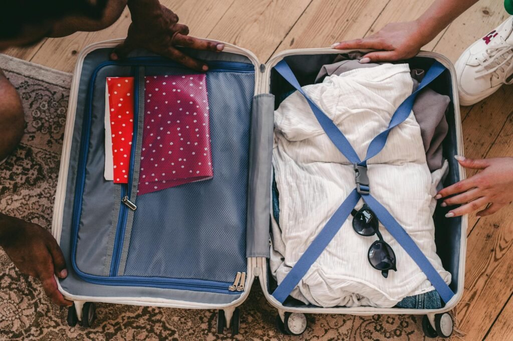 A packed work bag, lunch container, and clothes prepared for the next morning.